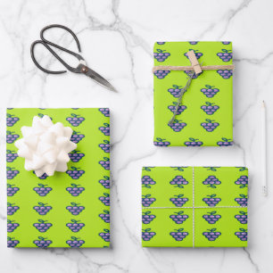 Purple grapes pattern on green wrapping paper sheet