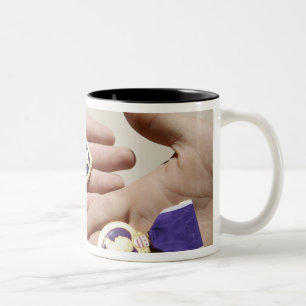 Purple Heart recipients display their medals Two-Tone Coffee Mug