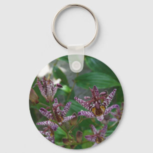 Purple pink white striped orchid like flower lilly key ring