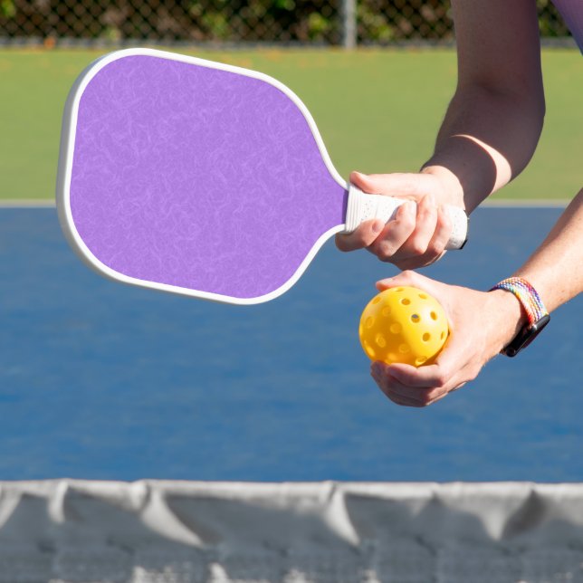 Purple textured surface with swirling pattern pickleball paddle (Insitu)