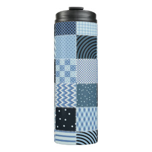 Quilt design, geometric patchwork, blue tones. thermal tumbler