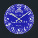 Quinceanera royal blue silver glitter tiara name round clock<br><div class="desc">For an elegant Quinceañera, 15th birthday. A trendy royal blue background colour. Decorated with faux silver glitter dust, a tiara crown. Personalise and add a name, age and a date. Quinceañera is written with a modern hand lettered style script with swashes.</div>