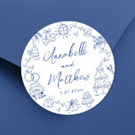Quirky Hand Drawn Blue Whimsical Wedding Classic Round Sticker<br><div class="desc">Personalised Hand-Drawn Quirky Blue Wedding Stickers. These fun and playful round wedding stickers feature quirky doodle illustrations surrounding the edges, all in a vibrant blue theme. Elements like a champagne tower, wedding cake, disco ball, hearts, wedding bells, rings, cameras, and more create a whimsical and celebratory vibe. The bride and...</div>
