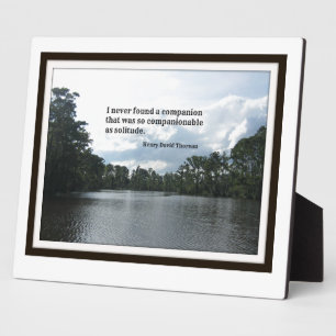 Quote about solitude on River scene. Plaque