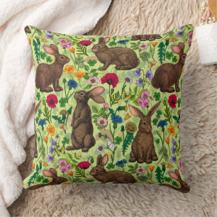 Rabbits and wildflowers on honeydew green cushion