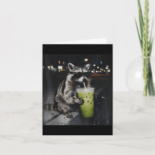 Racoon drinking iced matcha latte animal meme men card