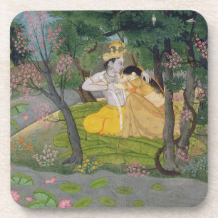 Radha and Krishna embrace in a grove of flowering Coaster