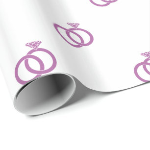 Radiant Orchid Wedding Rings on White Wrapping Paper