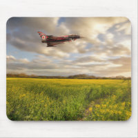 RAF Typhoon Eurofighter jet flying over rapeseed c