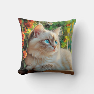 Ragdoll cat portrait with flowers cushion