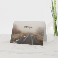 Railroad Track in Foggy Winter Landscape