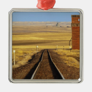 Railroad tracks lead to old granary at Collins Metal Tree Decoration