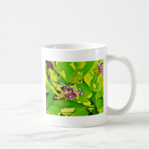 Rainbow coloured Dragonfly  on a purple pink flowe Coffee Mug