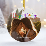 Rainbow Happy Holidays LGBTQ Couple Photo Ceramic Tree Decoration<br><div class="desc">Elegant Happy Holidays photo ornament with beautiful rainbow cursive typography. This modern LGBTQ holiday couple photograph gift features gorgeous script and your name in white over the full bleed picture of an LGBT couple. Personalise this cute keepsake Christmas ornament with your favourite photograph.</div>