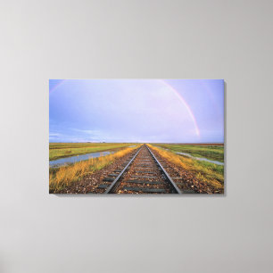 Rainbow over railroad tracks near Fairfield Canvas Print