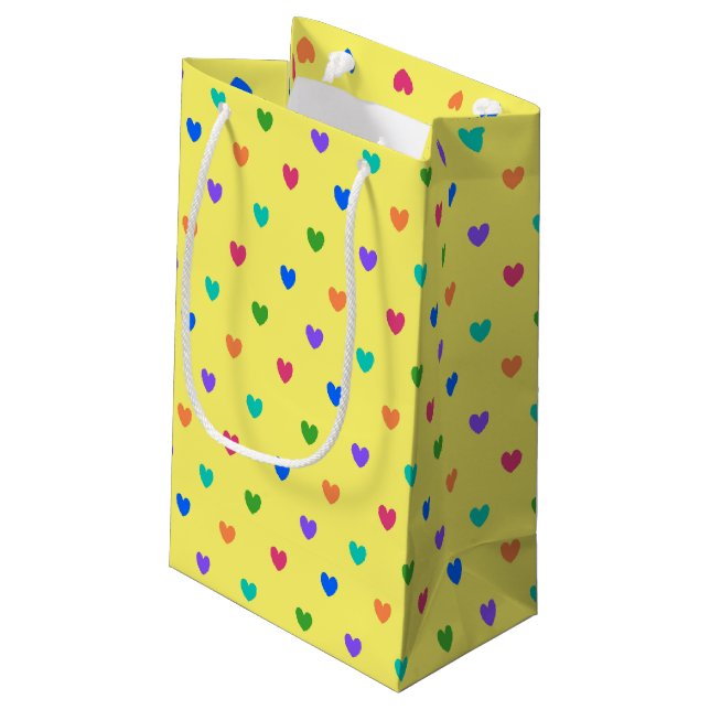 Rainbow polka hearts on yellow small gift bag (Back Angled)