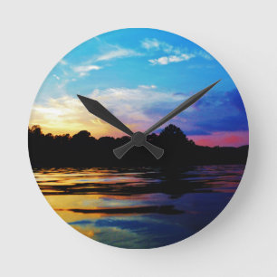 Rainbow sunset on mountain Lake Round Clock