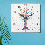 Rainbow Tree Gold Stars Square Wall Clock<br><div class="desc">This whimsical clock is decorated with a print of a Tree Of Life design in rainbow colours and gold stars. The tree was originally made in mosaic using tiny fragments of brightly coloured glass. Because we create our own artwork you won't find this exact image from other designers. Original Mosaic...</div>