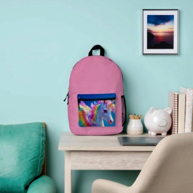 Rainbow Winged Prancing Unicorn  Printed Backpack (Backpack – D: 17"x12.5"x5" Two-chamber design with laptop storage pouch. Mesh side pocket.
)