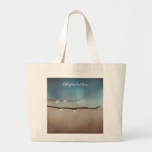 Raindrops on a tree branch large tote bag