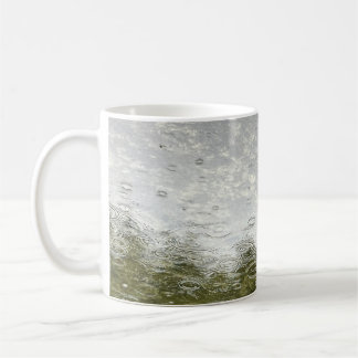 Raining on pond coffee mug