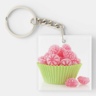 Raspberry tasty candy sweets in green cup cake key ring