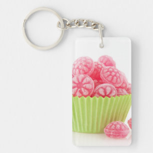Raspberry tasty candy sweets in green cup cake key ring