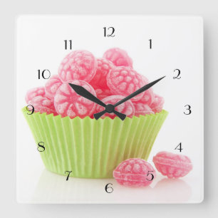 Raspberry tasty candy sweets in green cup cake square wall clock