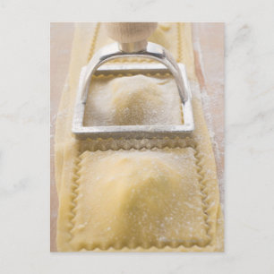 Ravioli with pastry cutter, close up postcard