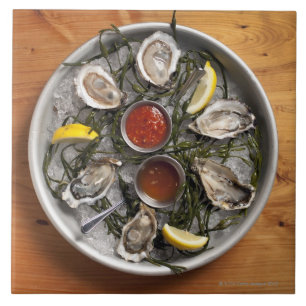 Raw oysters arranged tile