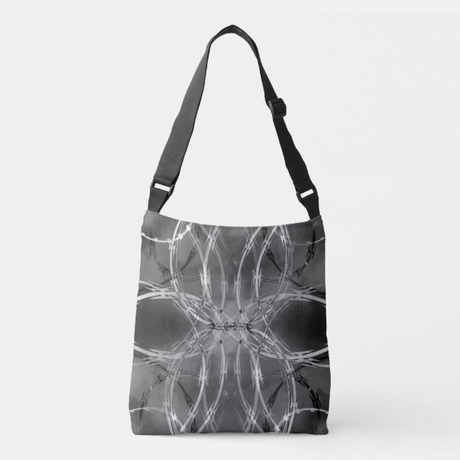 Razor wire pattern against dark clouds crossbody bag (Front)