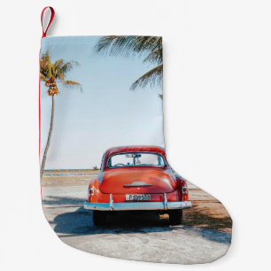 Re beetle beside coconut trees small christmas stocking
