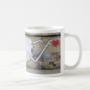 Reaching for a heart coffee mug