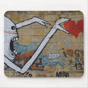 Reaching for a heart mouse mat