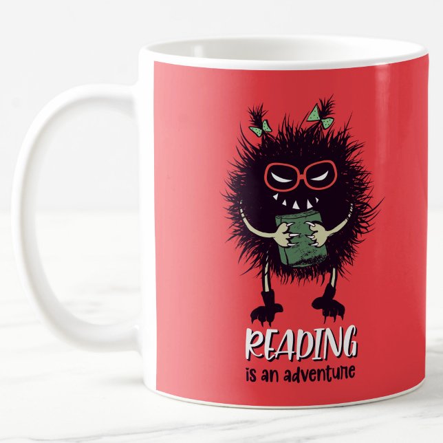 Reading is adventure funny teacher coffee mug (reading is an adventure orange reddish mug weith evil character holding a book)