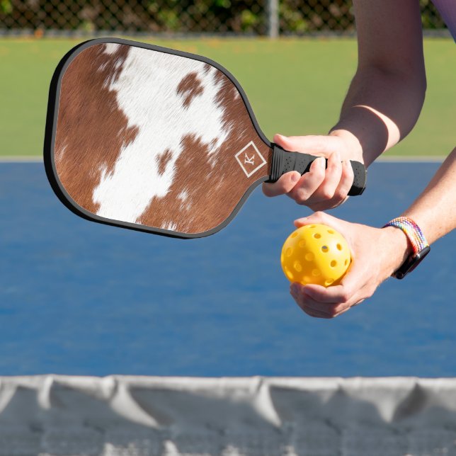 Realistic brown and white cowhide texture monogram pickleball paddle (Insitu)