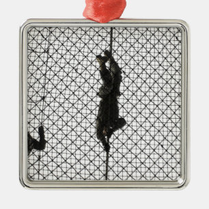 recruits completing an obstacle metal tree decoration