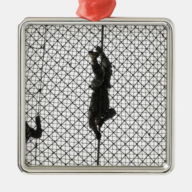 recruits completing an obstacle metal tree decoration (Front)