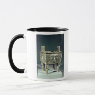 Rectangular 'ting' vessel with human faces mug