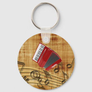 Red accordion, black notes, gold background key ring