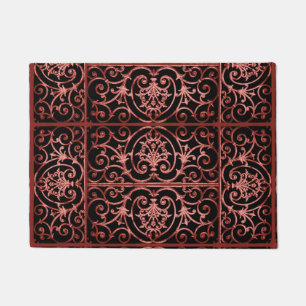 Red and black scrollwork pattern doormat