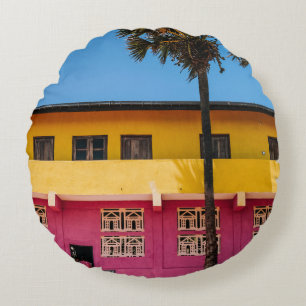 RED AND BROWN CONCRETE BUILDING NEAR TREE UNDER BL ROUND CUSHION