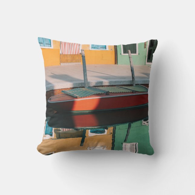 RED AND GREEN BOAT DOCKING ON DOCK CUSHION (Front)