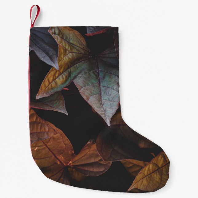 RED AND GREEN LEAVES ON BLACK BACKGROUND SMALL CHRISTMAS STOCKING (Front)