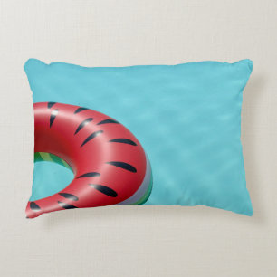 Red and green lifebuoy on swimming pool decorative cushion