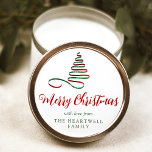 Red and Green Ribbon Tree Merry Christmas Script Classic Round Sticker<br><div class="desc">This modern holiday sticker features a red and green ribbon Christmas tree above the words "Merry Christmas" in stylish red calligraphy script. Personalise it with your family's name in green serif font.</div>