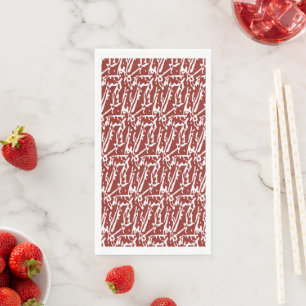 Red and orange abstract shapes blend and overlap a napkin