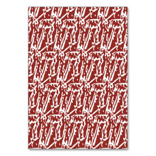 Red and orange abstract shapes blend and overlap a table number