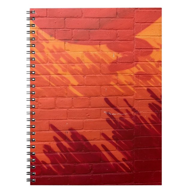 Red and orange painted brick wall notebook (Front)