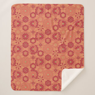 Red and orange pattern sherpa blanket